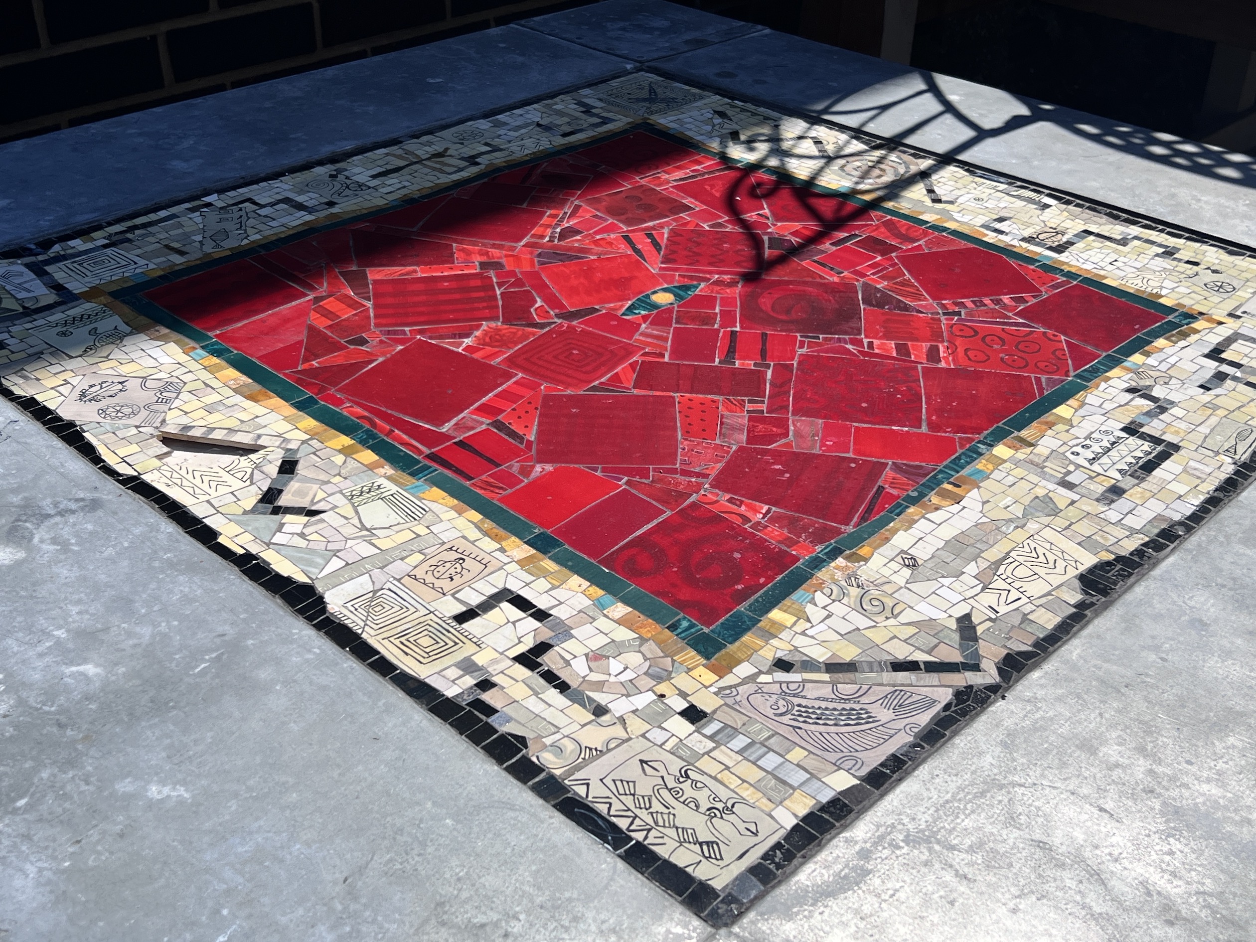 A square mosaic topped zinc garden table, width 122cm, height 77cm